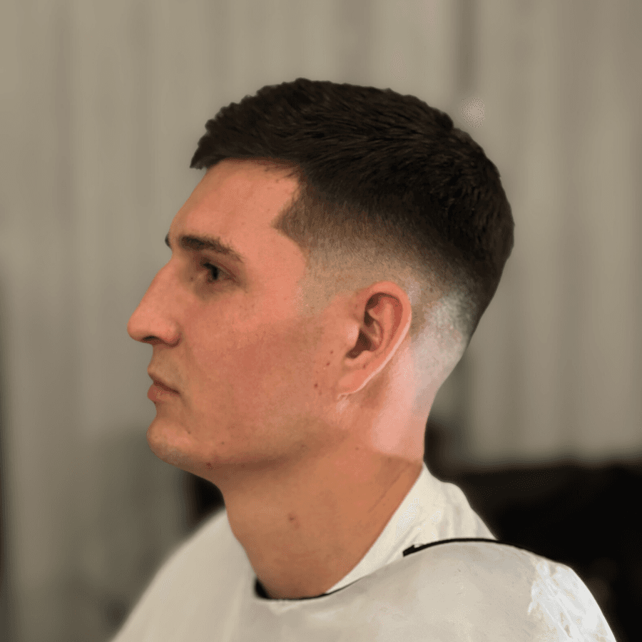 person holding white and gold hair comb