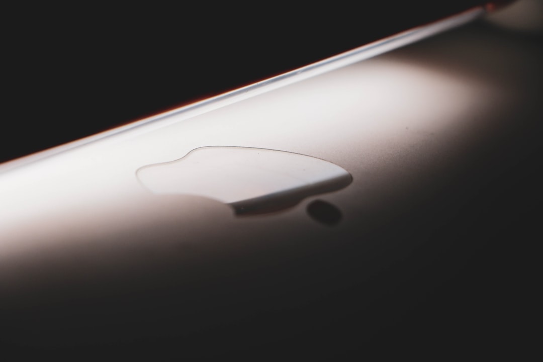 a close up of the back of an apple laptop