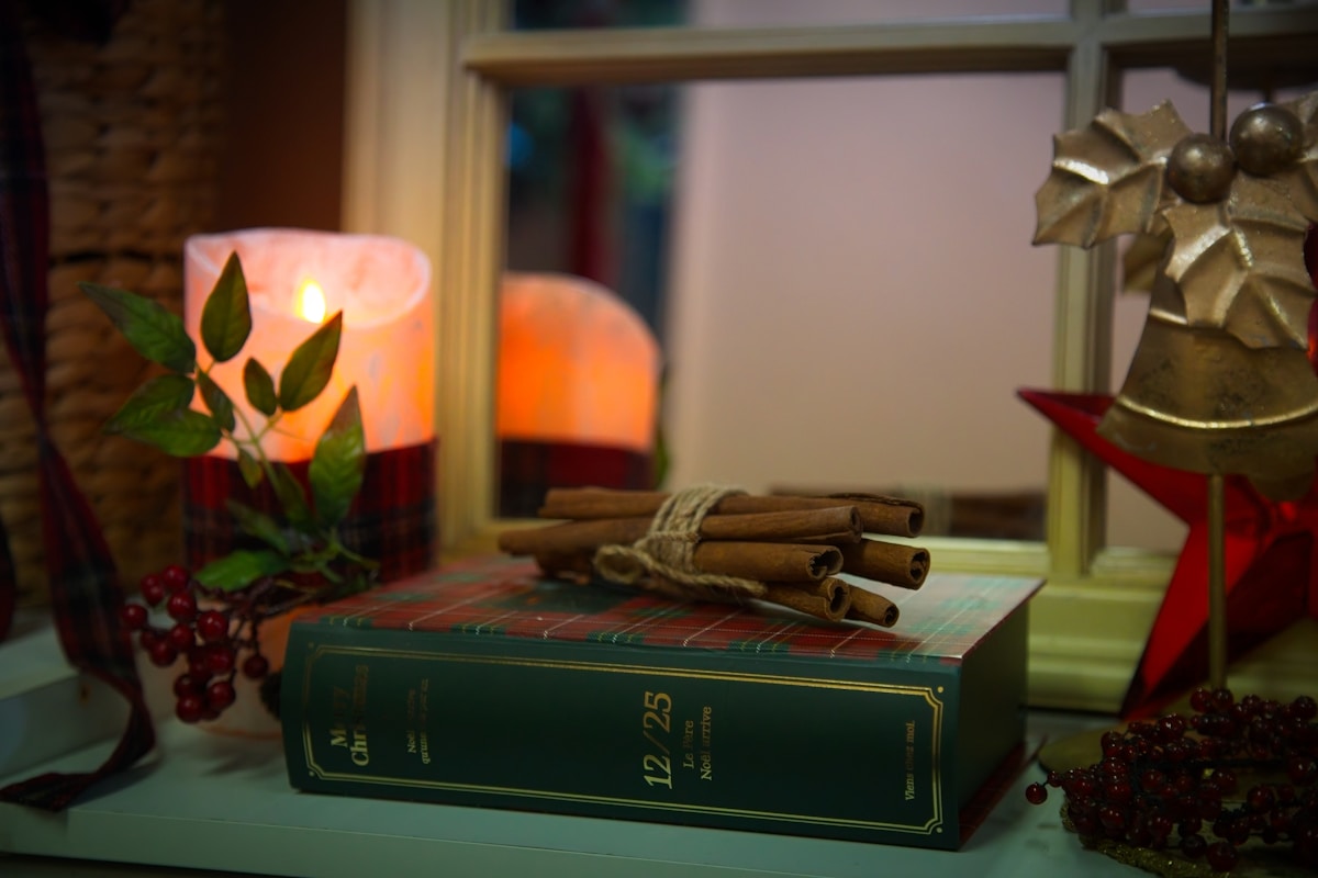 A candle and keepsakes in warm light