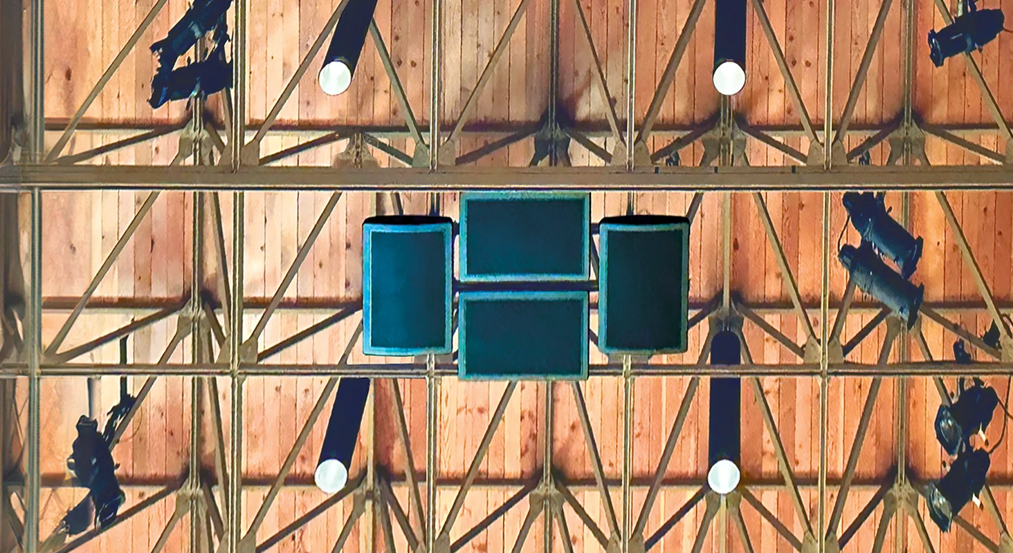 Overhead view of ceiling spotlights and signage.