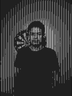 Man with bandana and red sunglasses waves hand