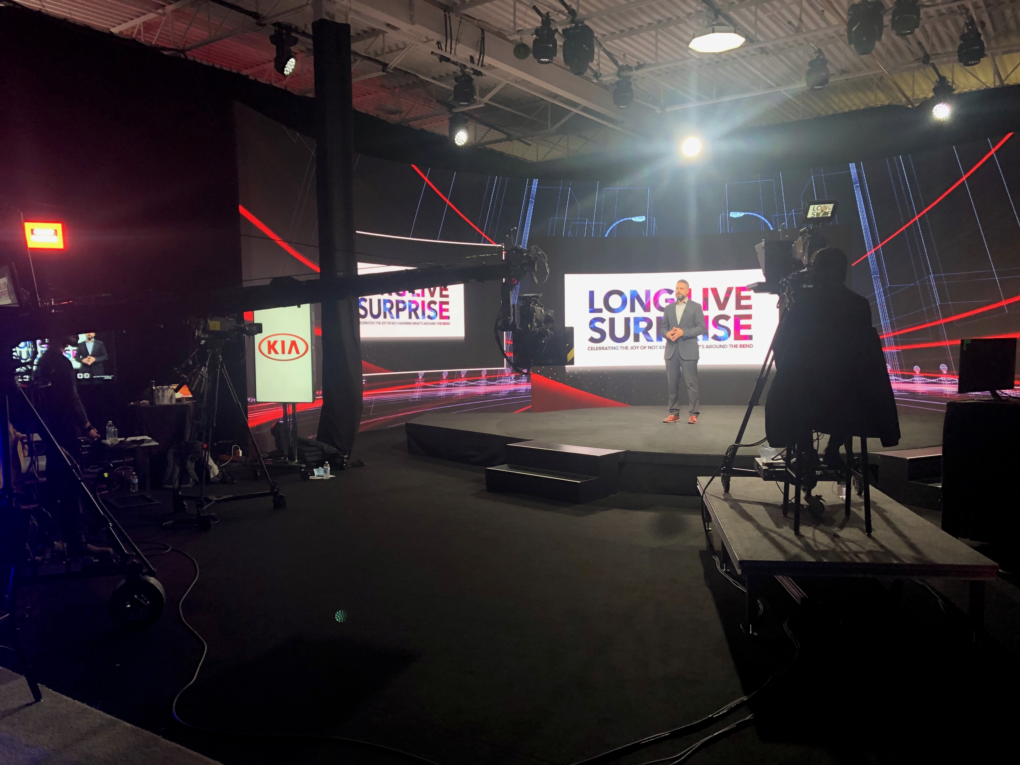 A person sitting in front of a computer screen with a glowing brain above their head.