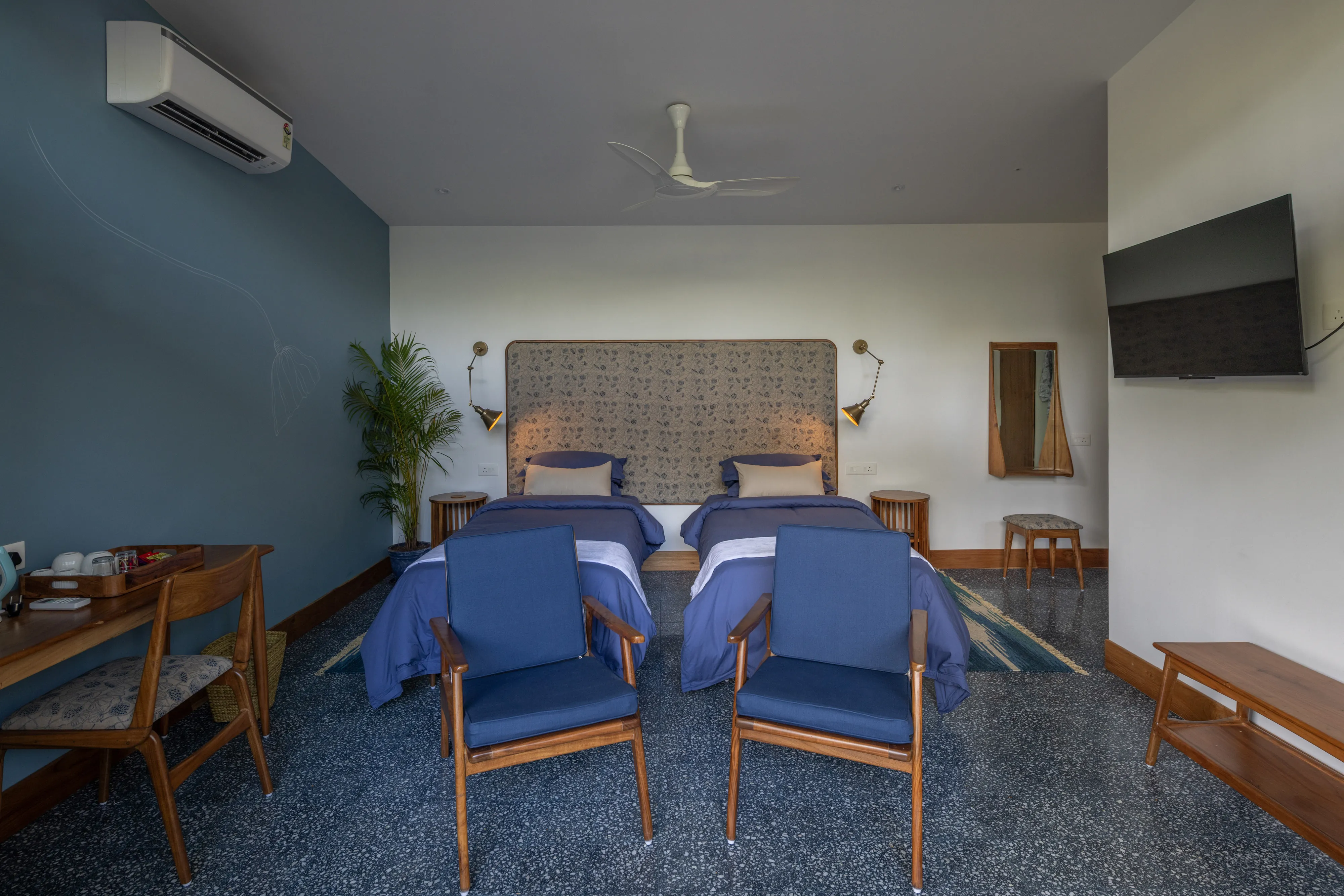 Cool-toned twin bedroom at Jaali Blue