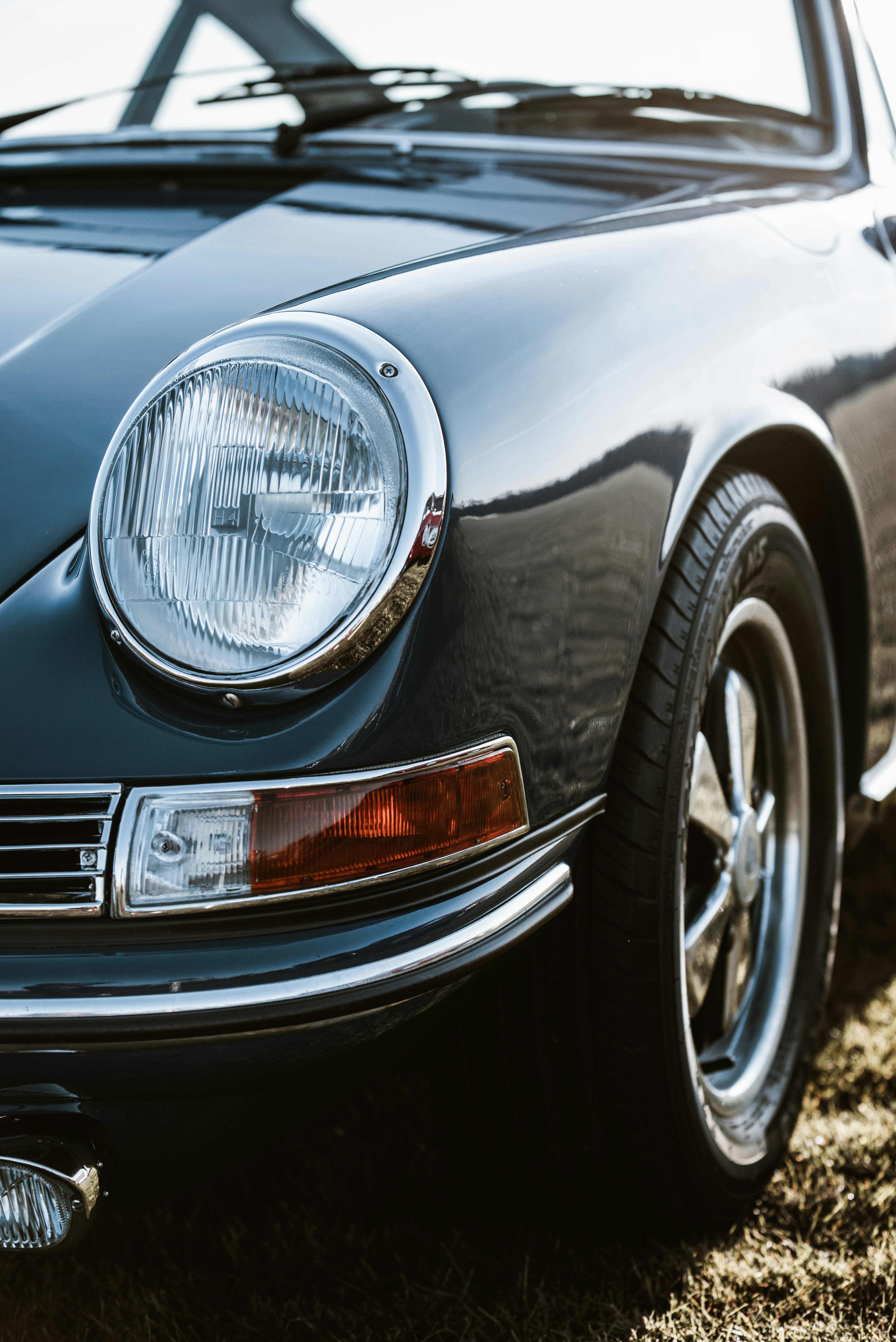 a close up of the front of a black sports car