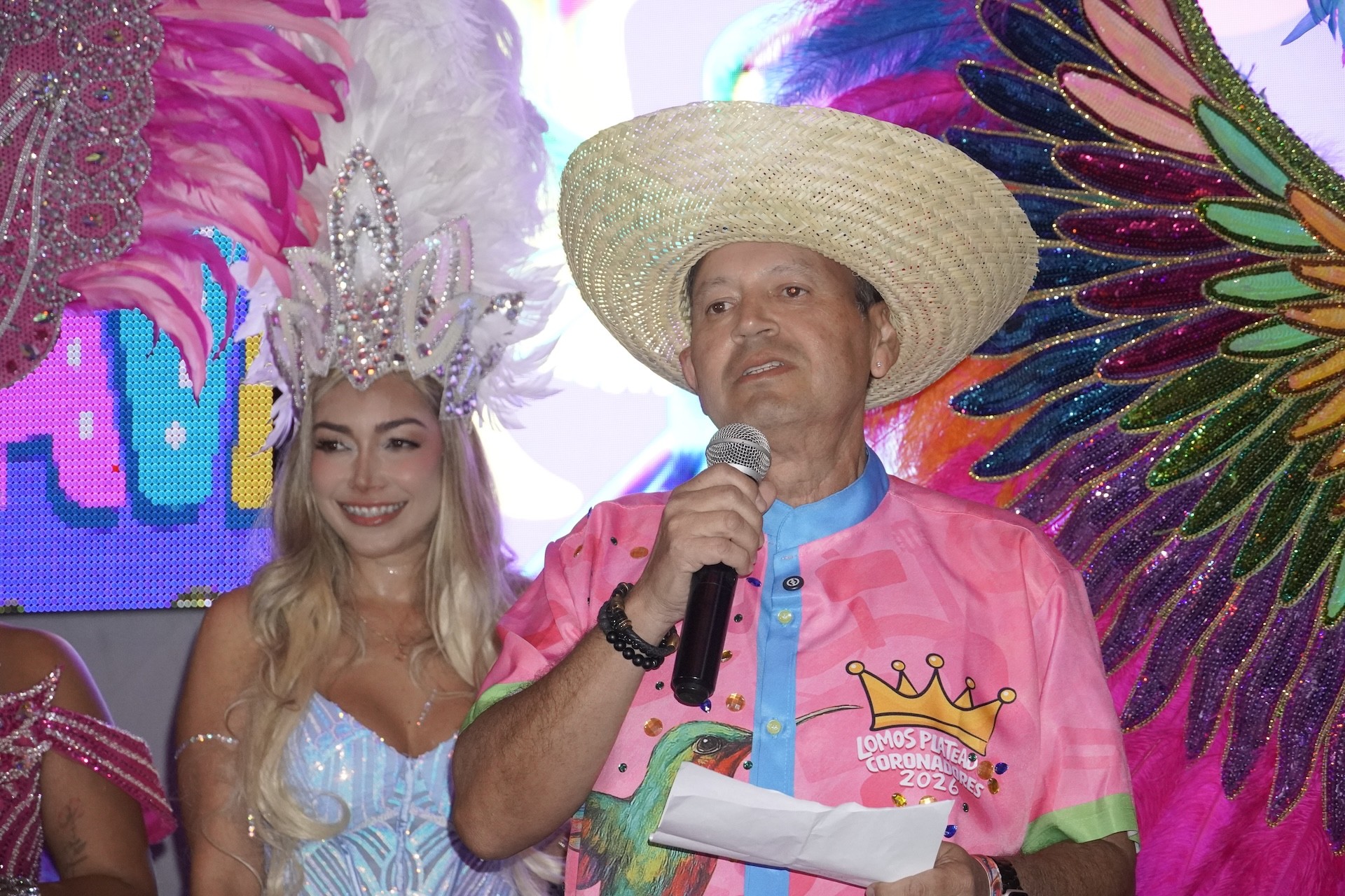 Smiling woman in feathered carnival costume