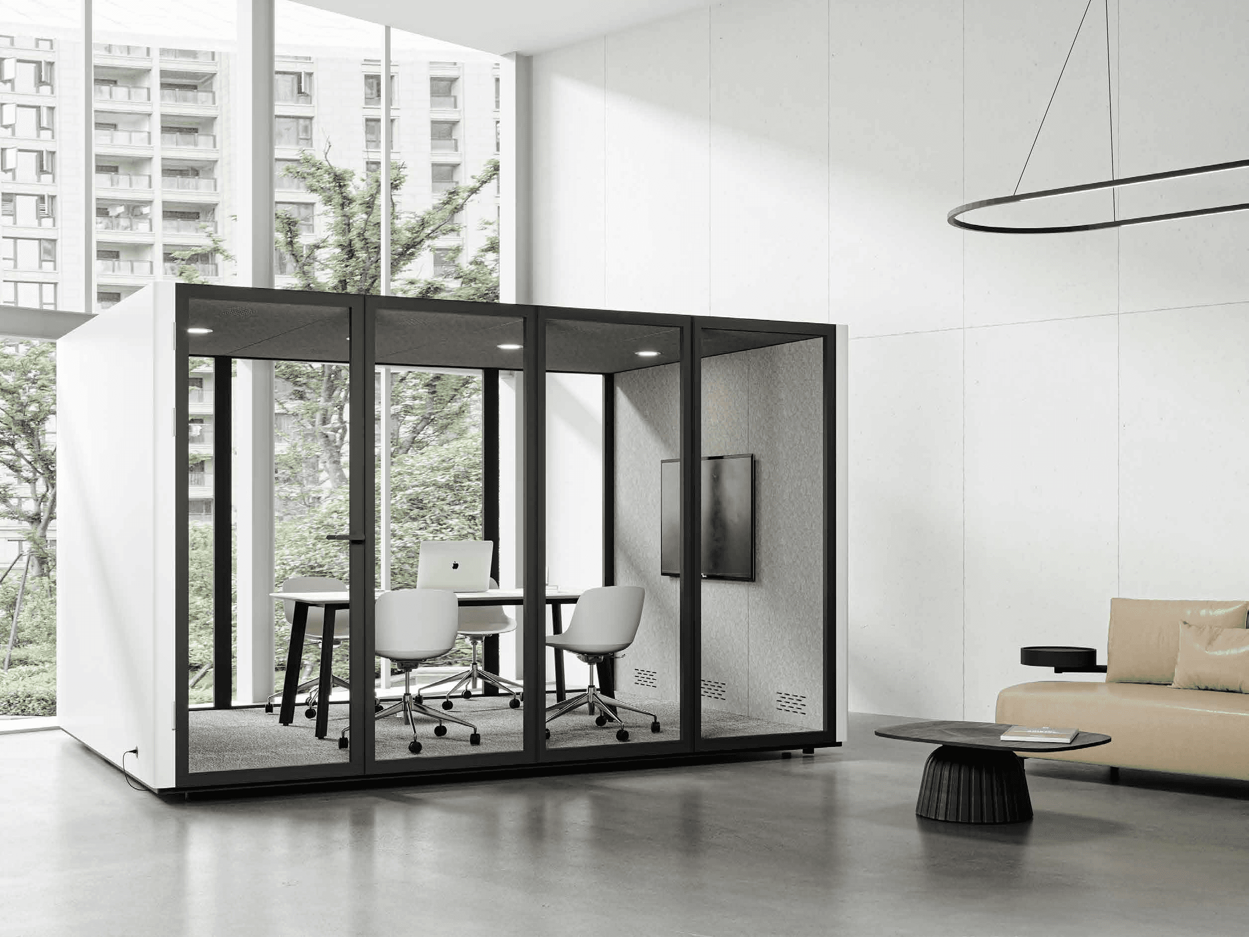 Two colleagues smiling while working together on a laptop.