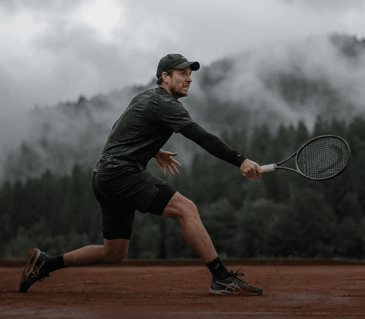 Tennis player hitting a dynamic forehand during a cardio tennis session at a local court in Virginia