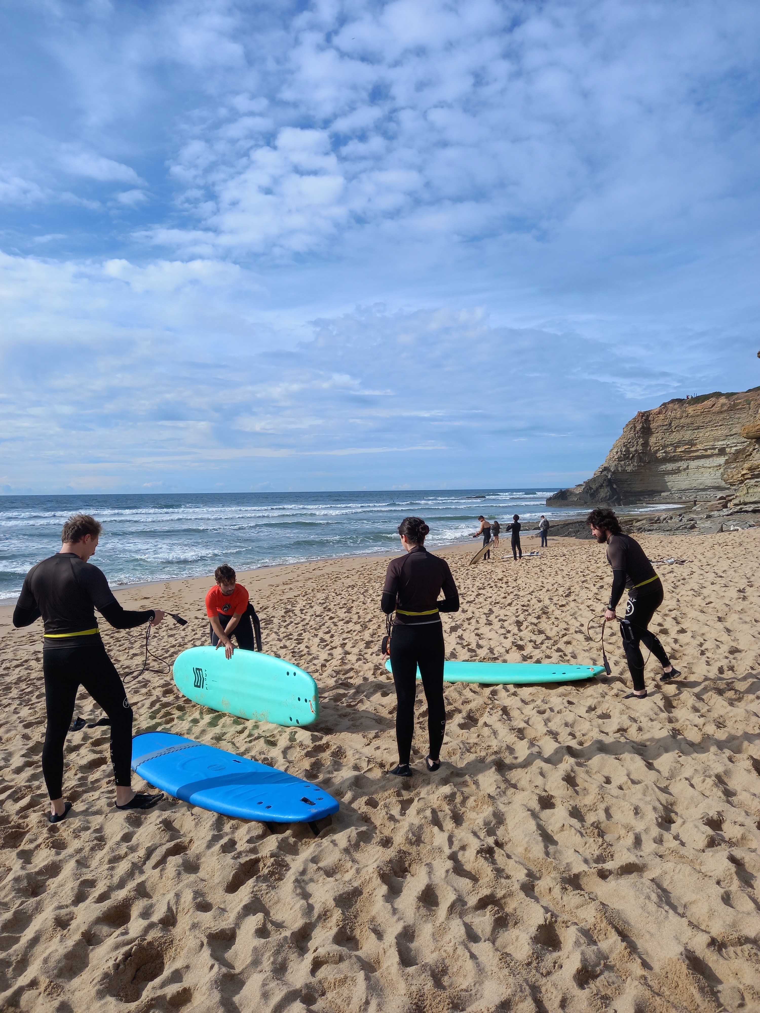 Digital nomads on the beach preparing to surf near Ericeira portugal
