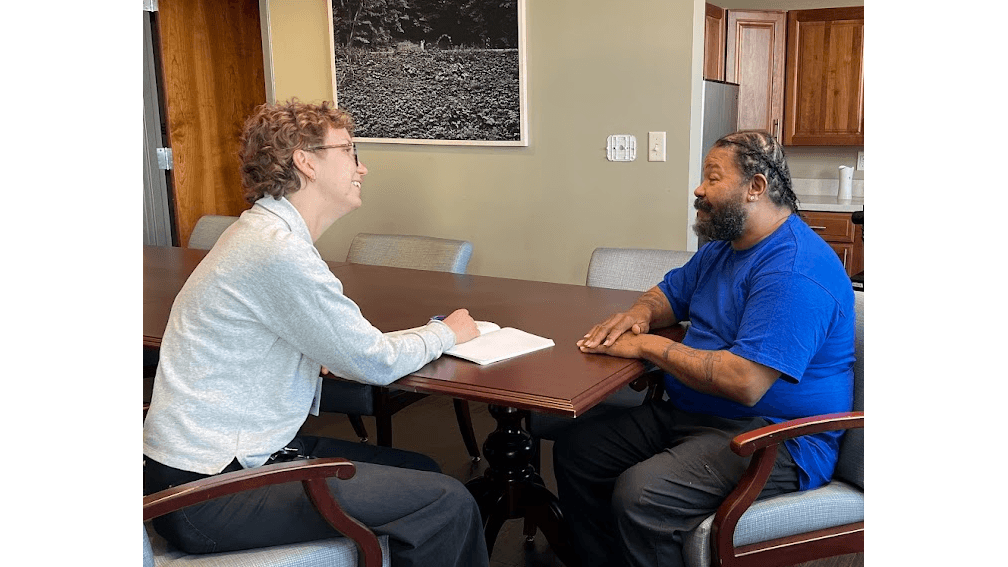 A JFS care manager works one-on-one with a client.