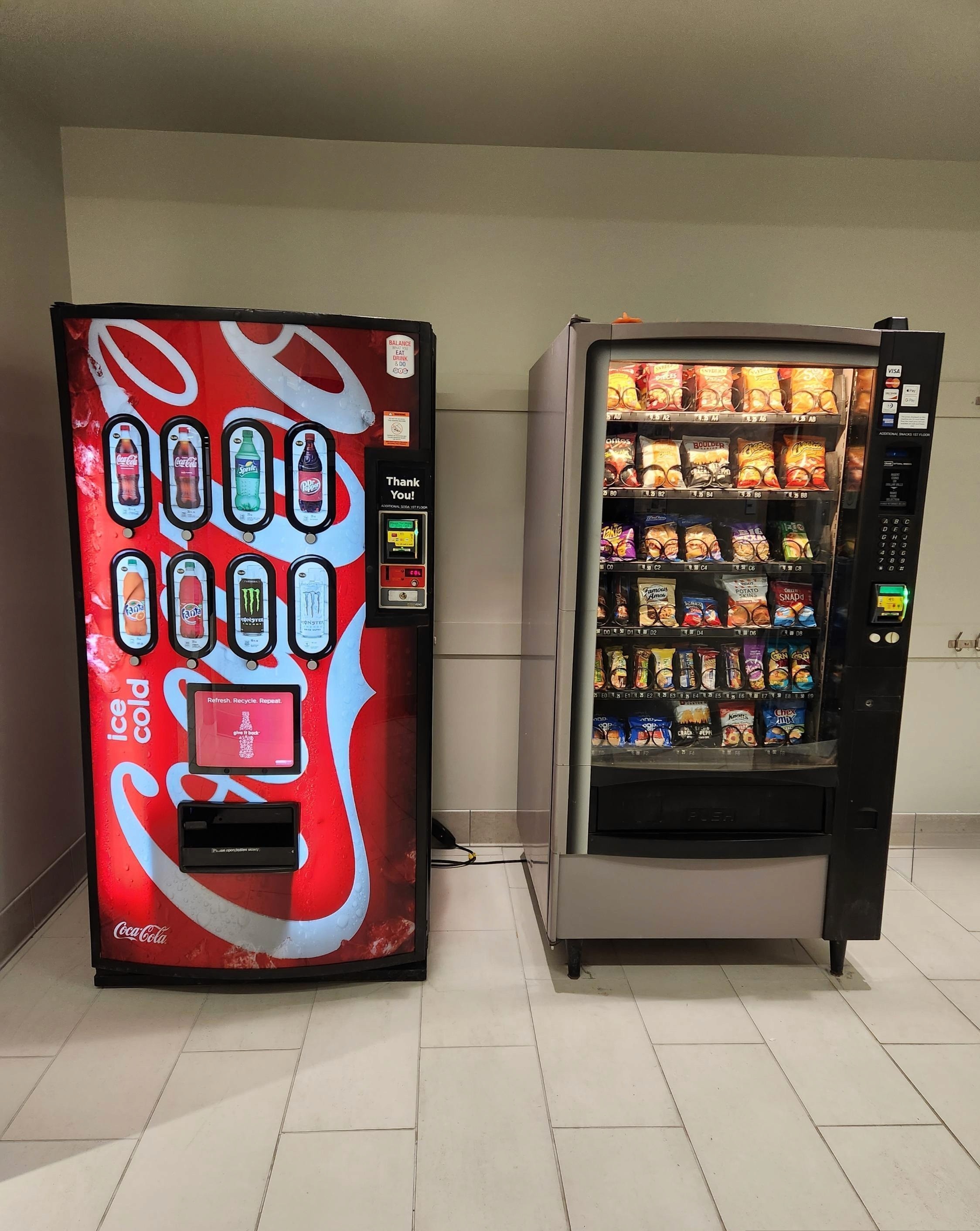 Soda and Snacks Machines Side by Side at Location