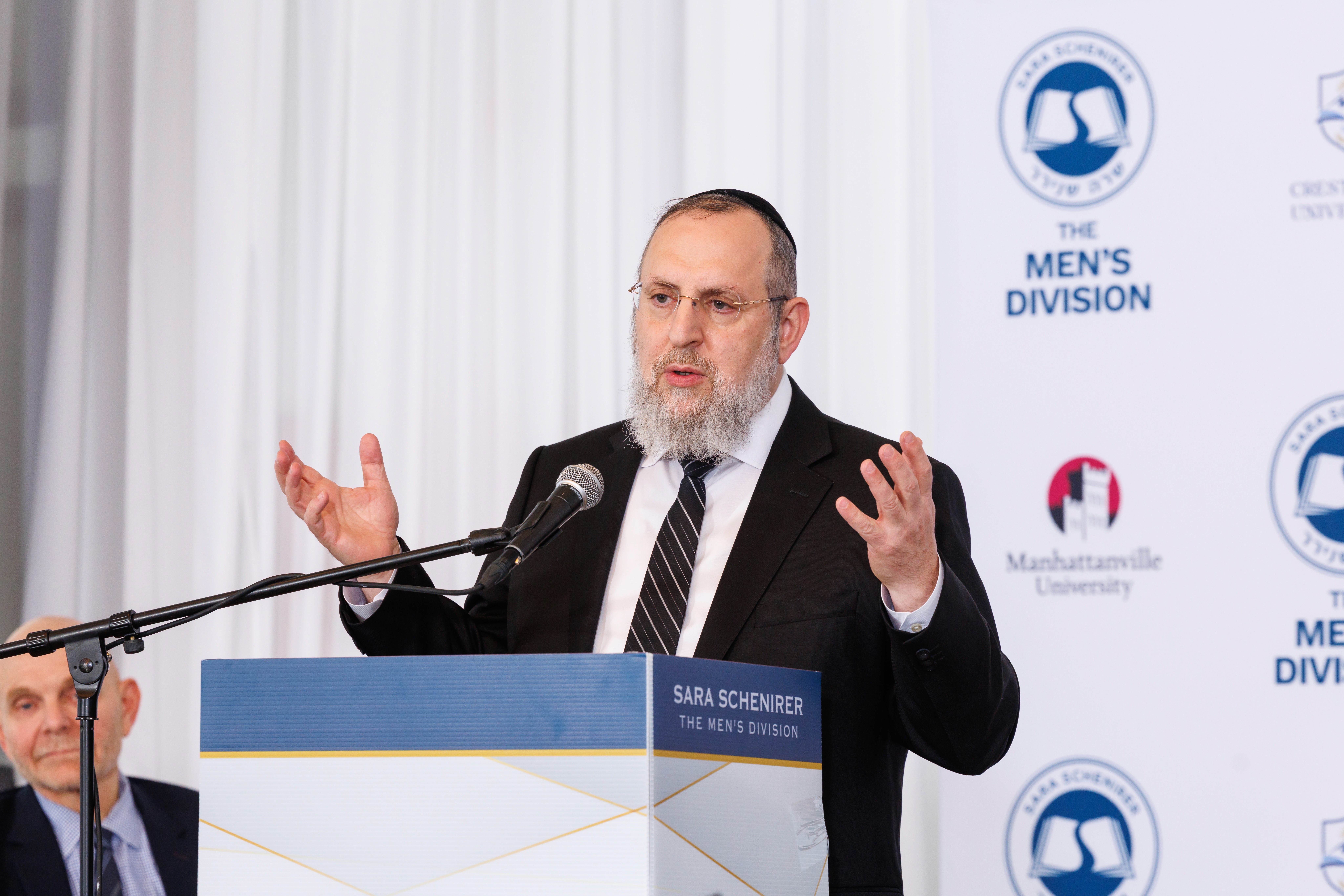 Rabbi Elazar Meisels speaking at Graduation