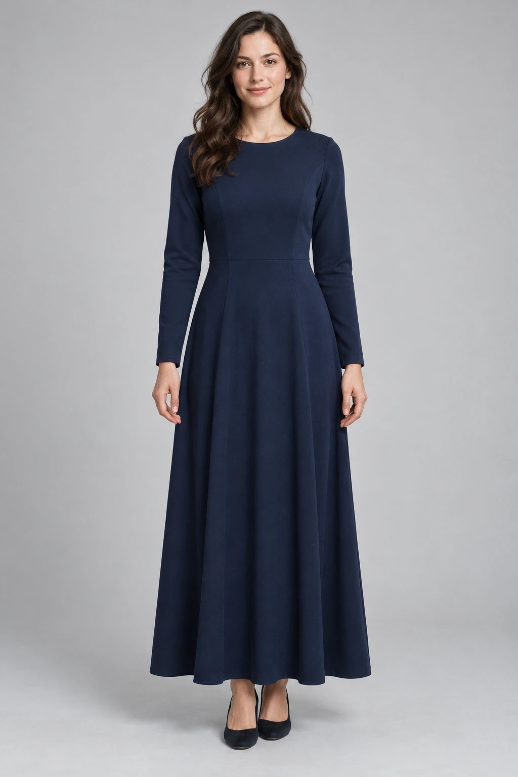 Full-length adult model wearing a fictional navy dress with hem and shoes visible