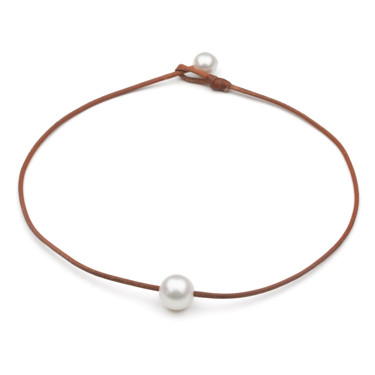 South Sea Pearl leather choker necklace with single pearl center and pearl toggle closure on cognac leather cord — Manos de Oro Saint Barth