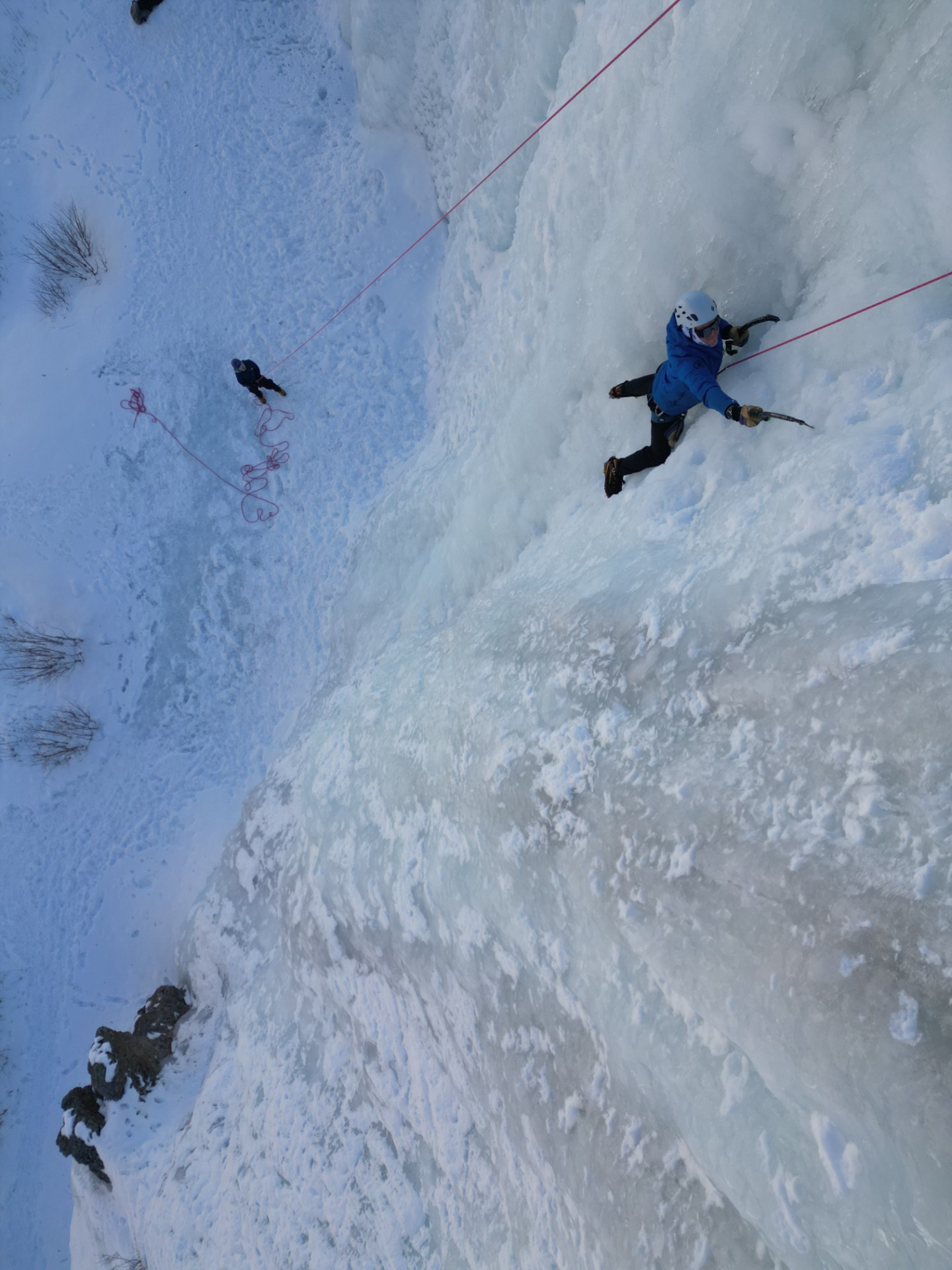Ice climber in Lake City Ice Park nears the top of the steep ice wall