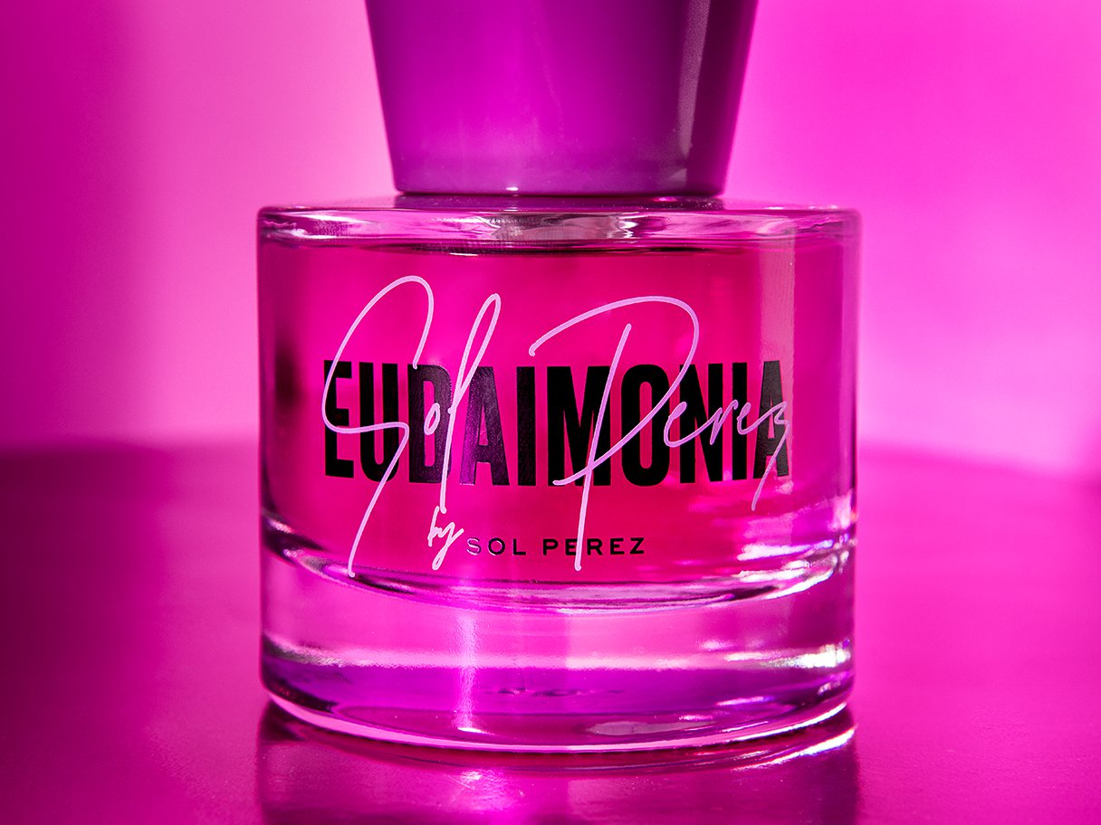 Rooftops of a coastal town with the sea in background