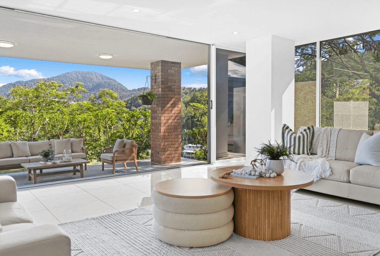 a man washing a car tire with a rag