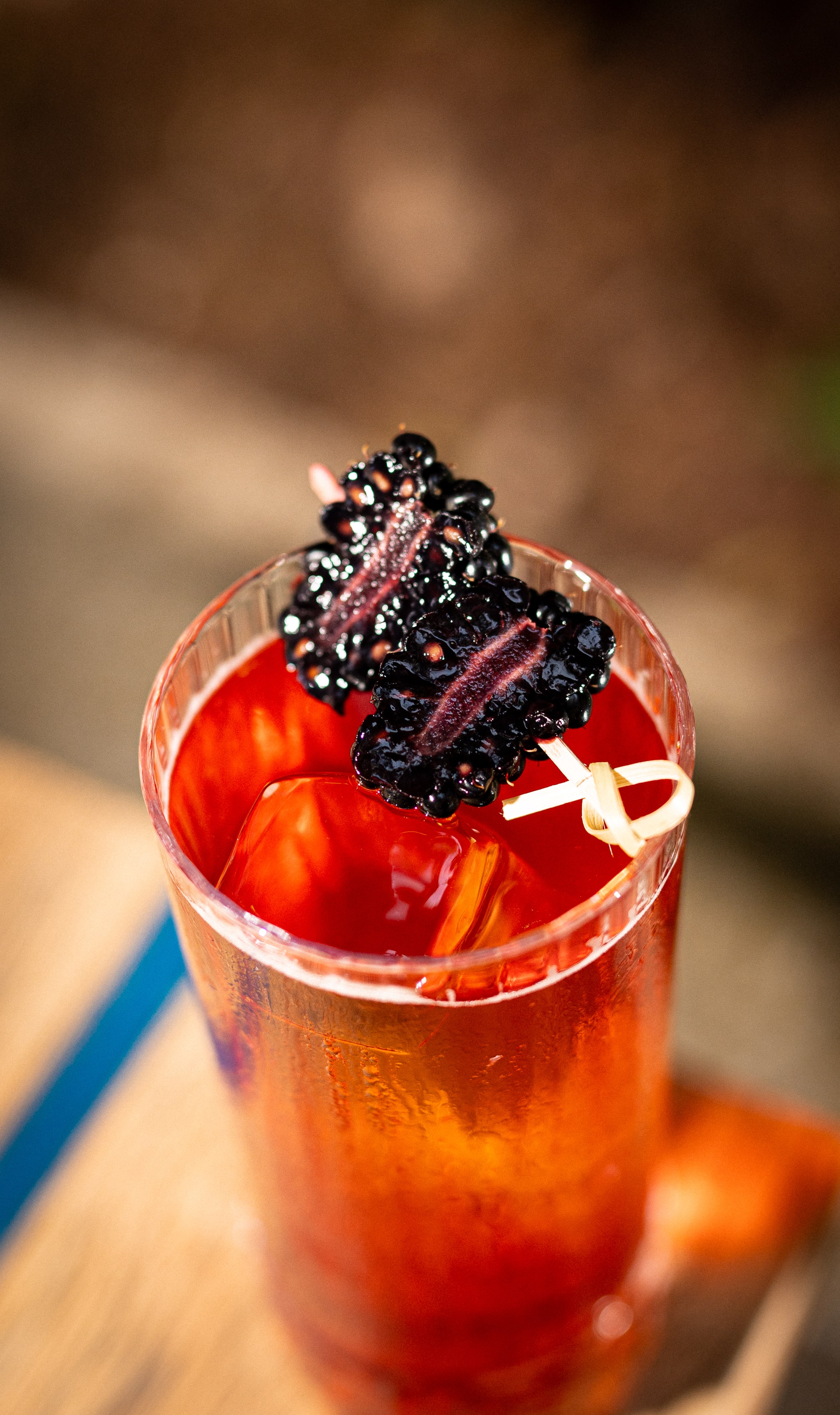 Colorful cocktail served in a glass with garnish