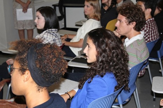students are taking part in a class, and they are concentrated