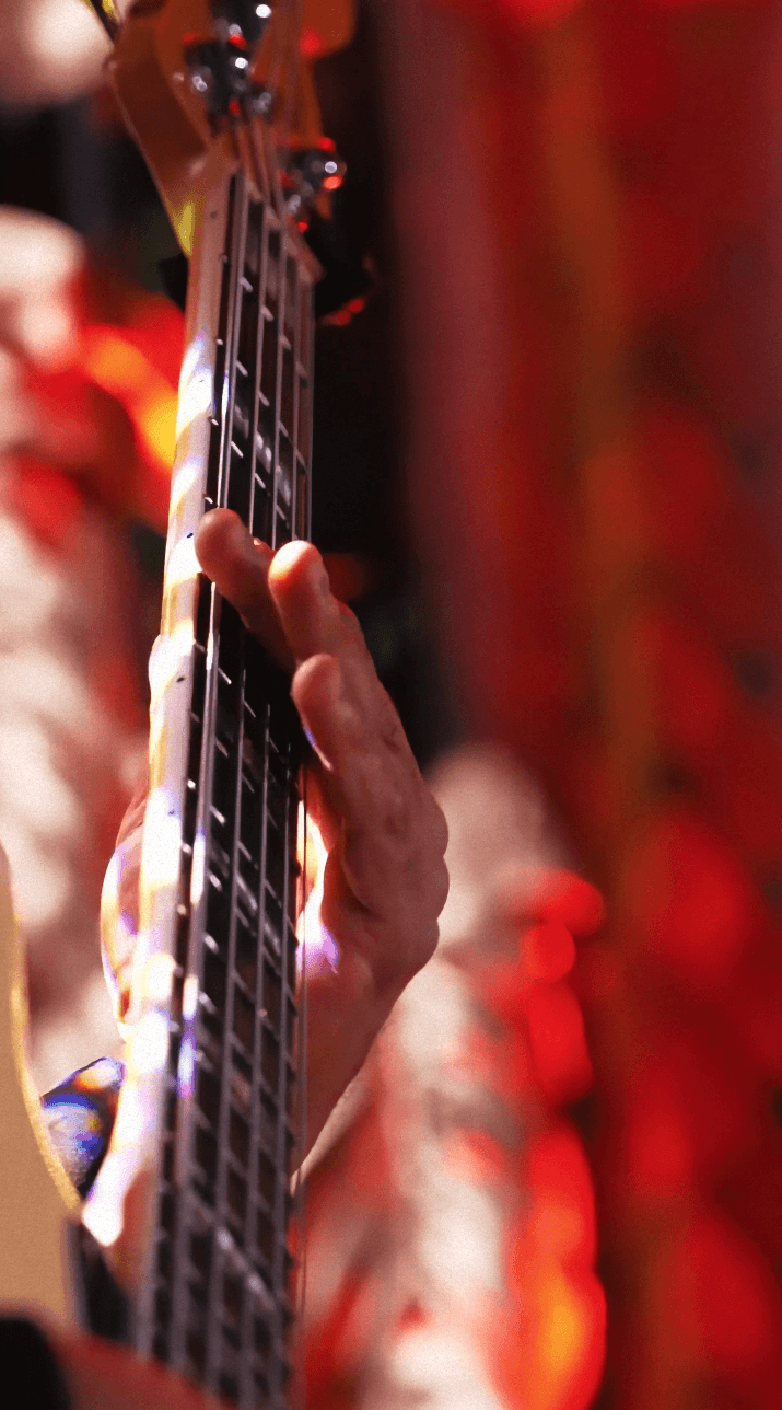 Woman in black outfit sitting on floor