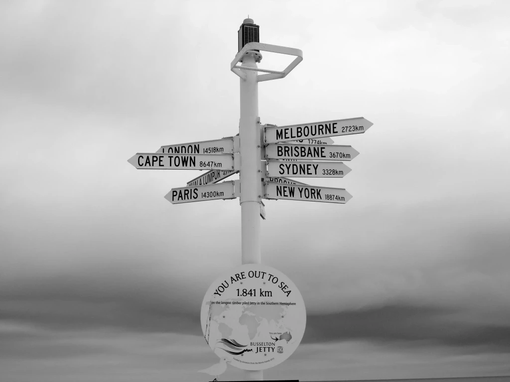 Busselton Jetty direction sign showing global cities near Margaret River Western Australia private jet charter travel routes