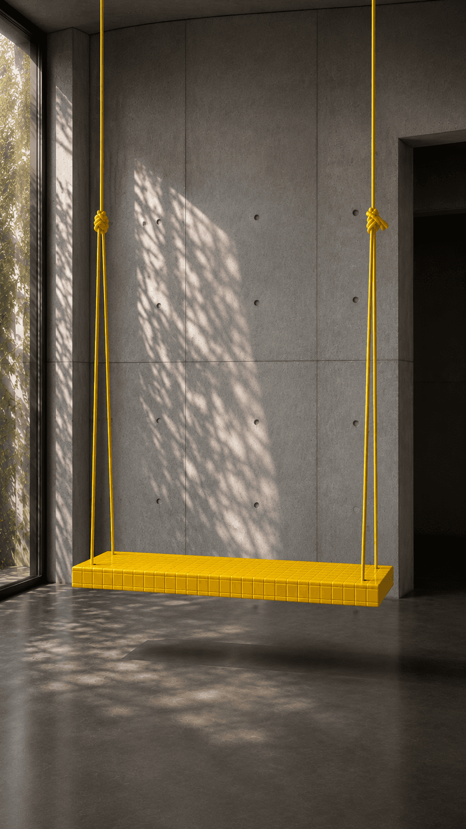 Yellow sculptural object in a concrete interior