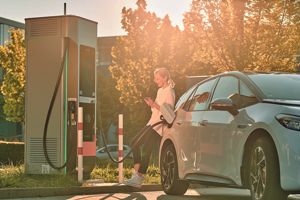 A team of pest controll experts carrying fog machine in an office