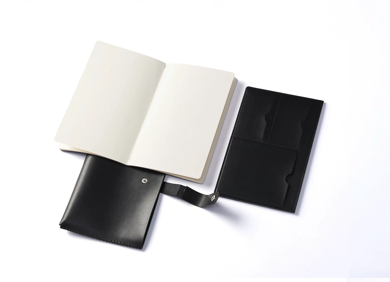 Open black cover showing interior pockets and separate notebook.