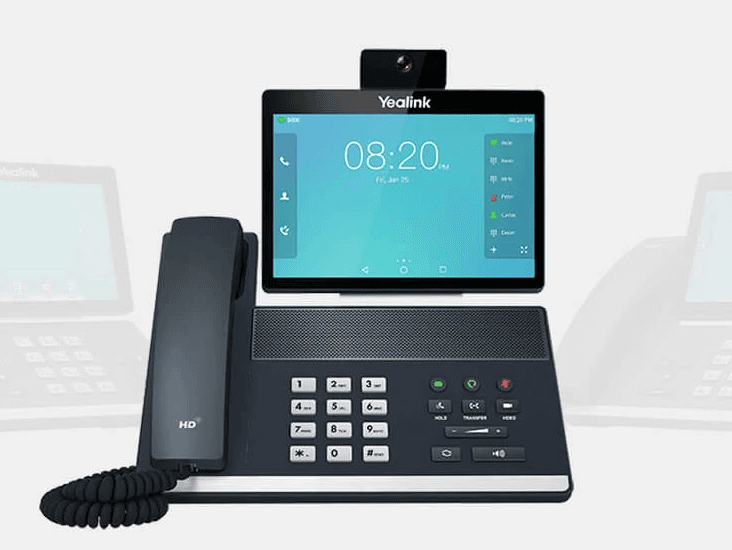 black ip desk phone on black wooden table