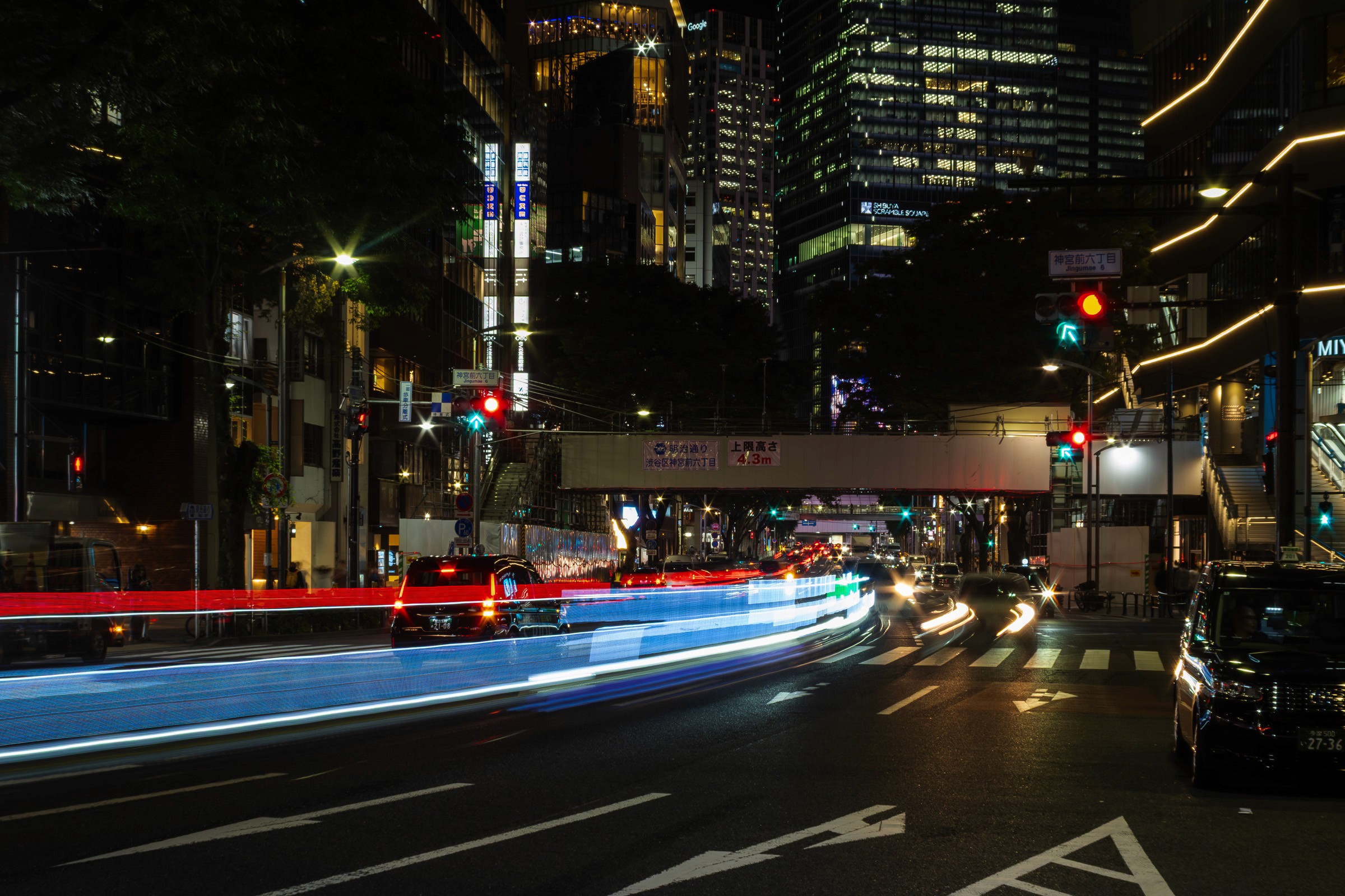 Namba street scene in Osaka at night, showing urban architecture and pedestrian movement