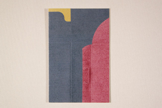 The image presents an abstract artwork on a light beige background. It features two distinct sections of color: a dark blue area on the left and a pinkish-red area on the right. The left section has a yellow, curved shape at the top edge. The right section has a curved pinkish-red shape that extends upward. The colors are arranged vertically, with the dark blue section on the left and the pinkish-red section on the right. There is no visible texture or pattern within the artwork; it is a flat, two-dimensional composition.