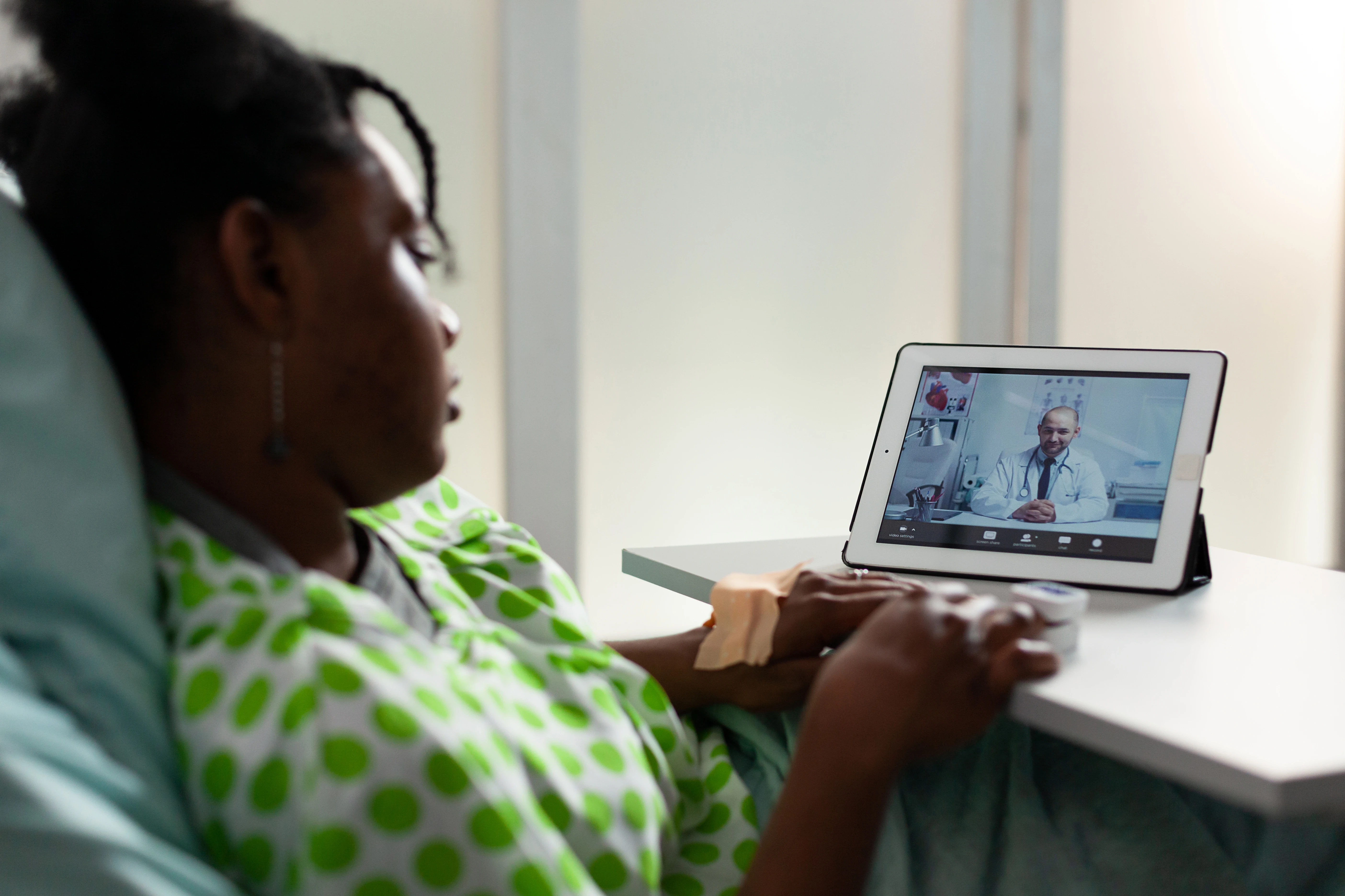 A woman talking video call with doctor hospital