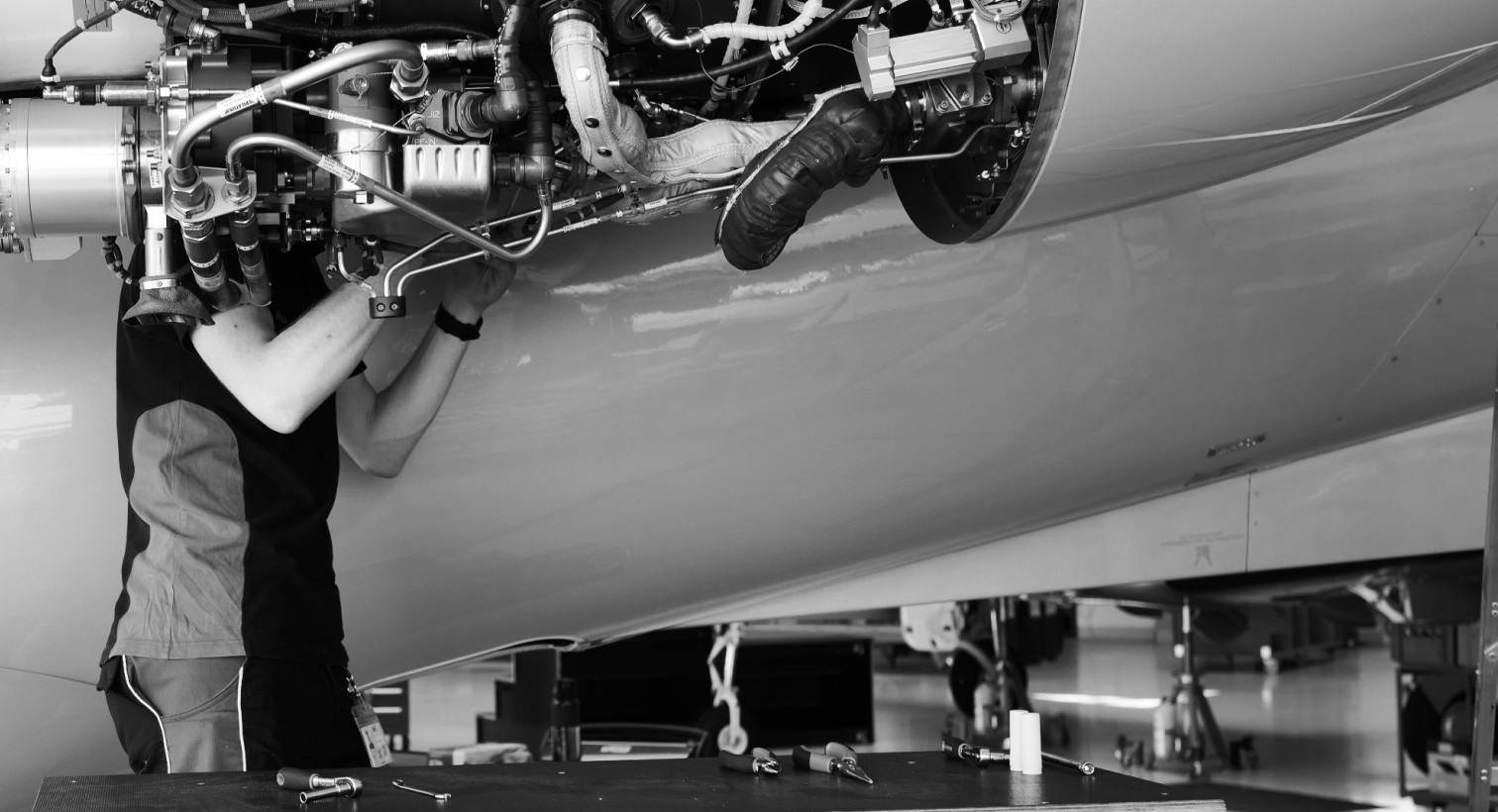 Engineer fixing aircraft part