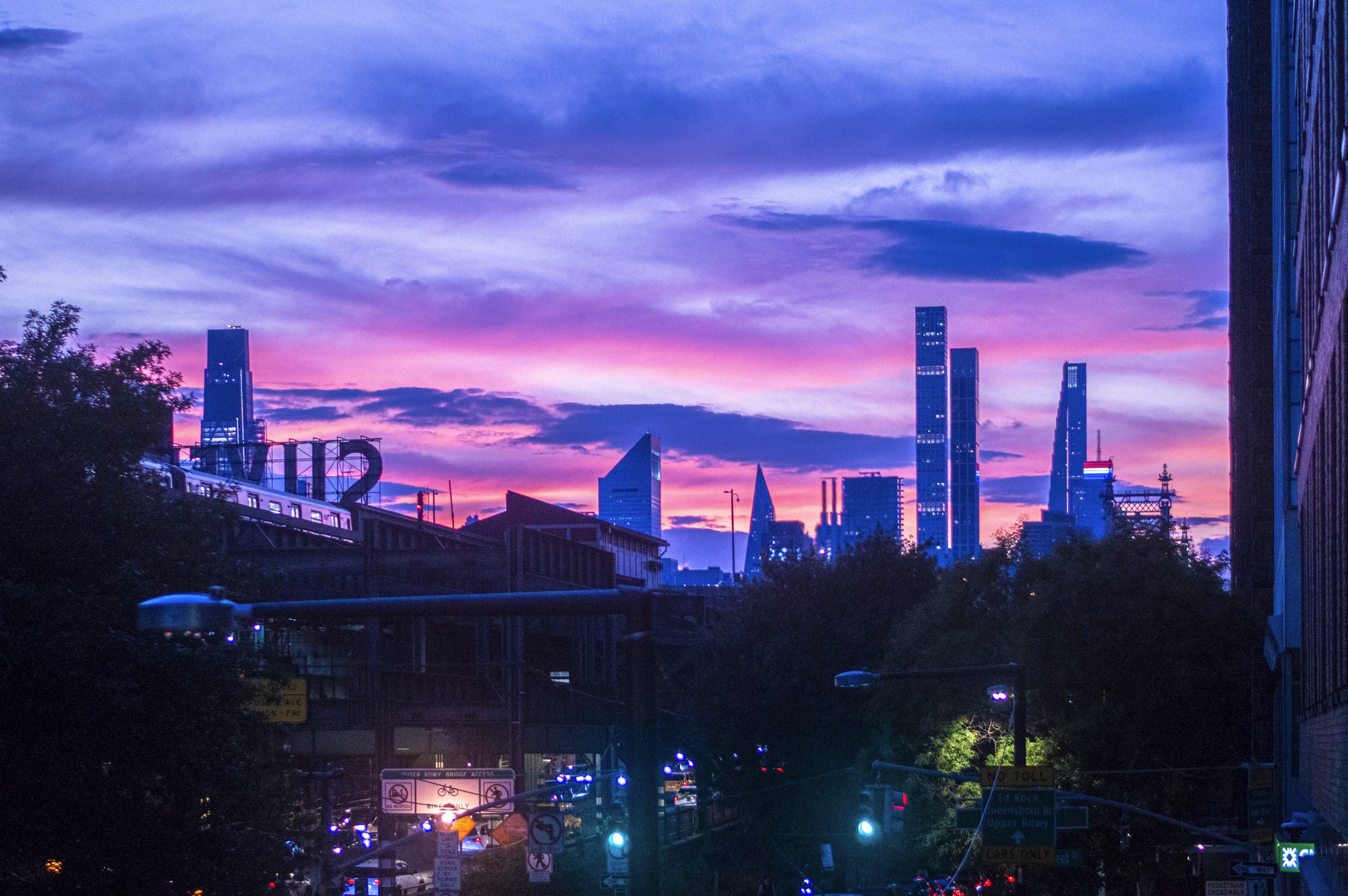 sunset shot of NYC from Queens