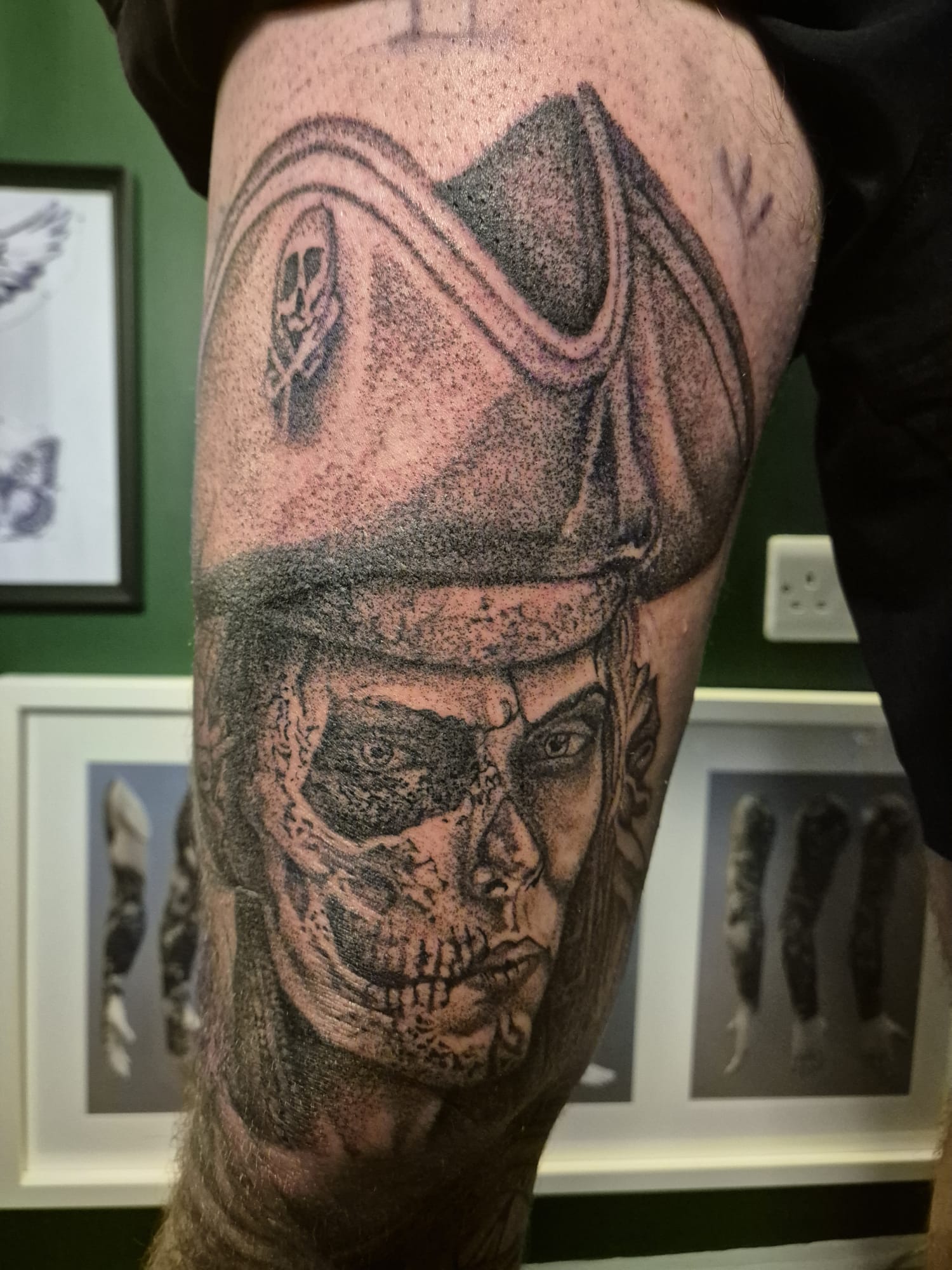 Black and grey leg tattoo of warrior helmet and skull in Hazel Grove