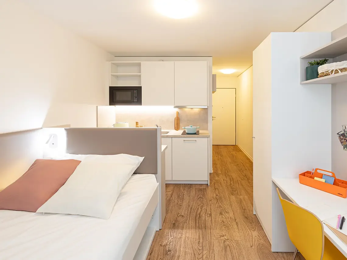 Modern refurbished student studio in Hamburg with private kitchenette, bed and study space