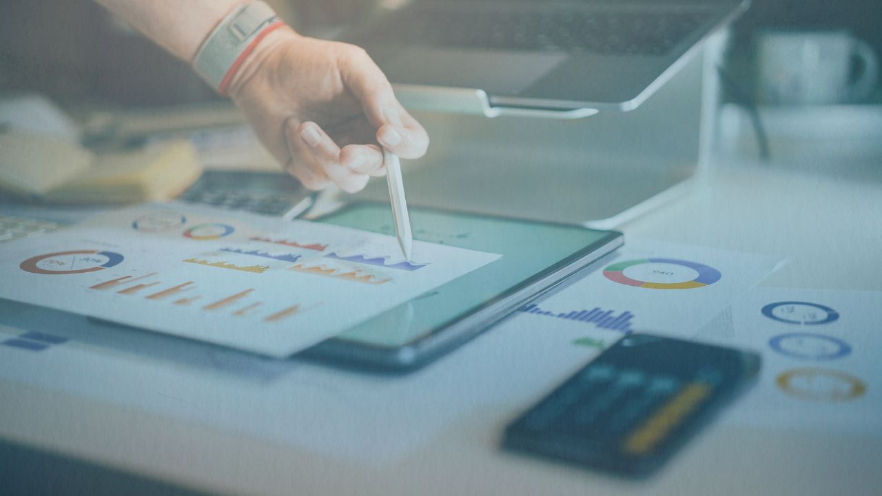 Employee working with charts and spreadsheets