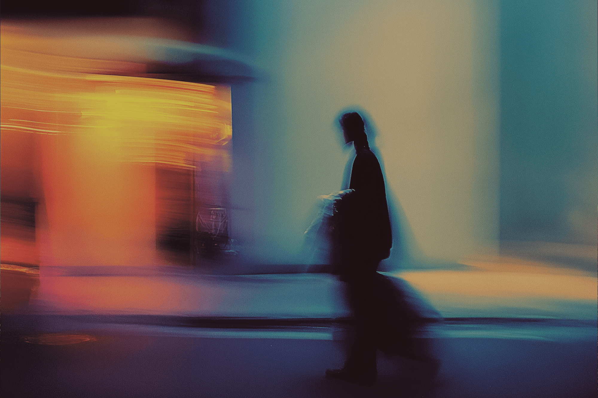 Silhouette of a person walking with motion blur in a colorful urban scene