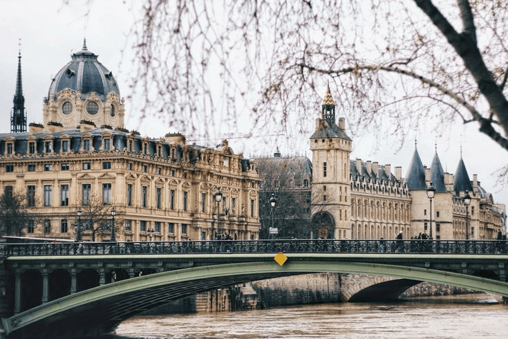 Friends laughing around a campfire in the woods