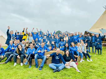 Branded Monese signage at summer festival entry