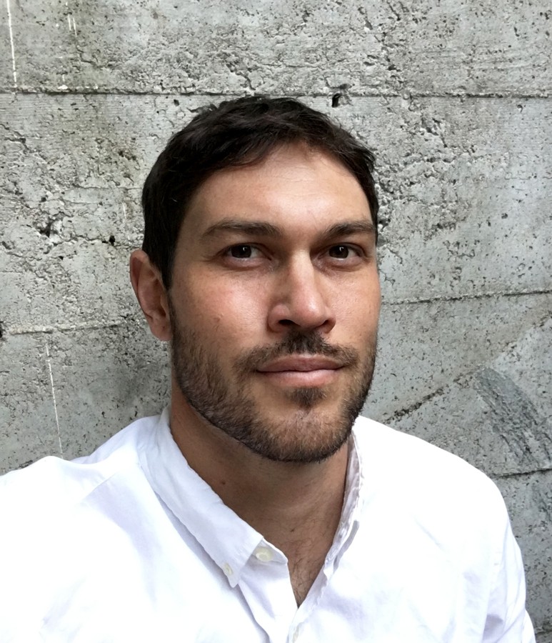 Black and white photo of man posing on camera