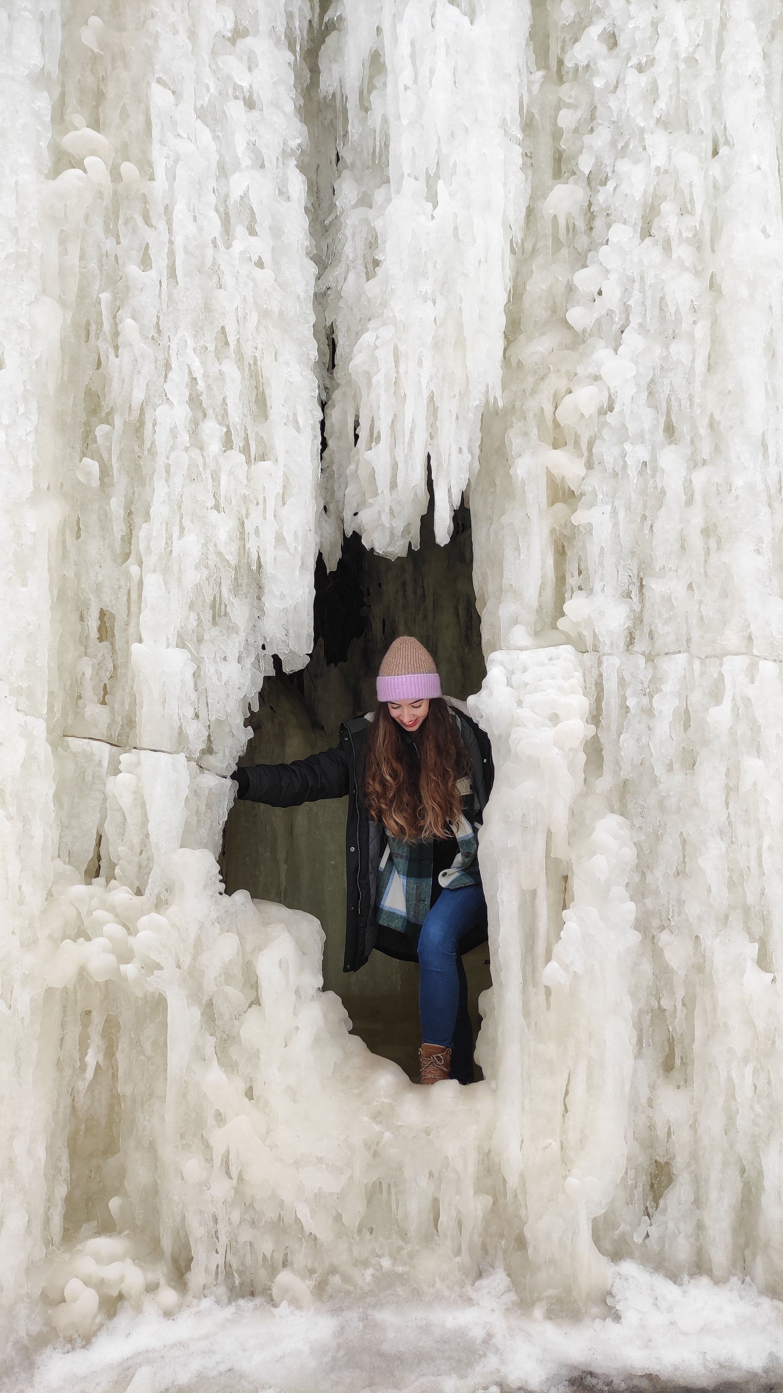  Chantal with a frozen waterfall in Estonia. 