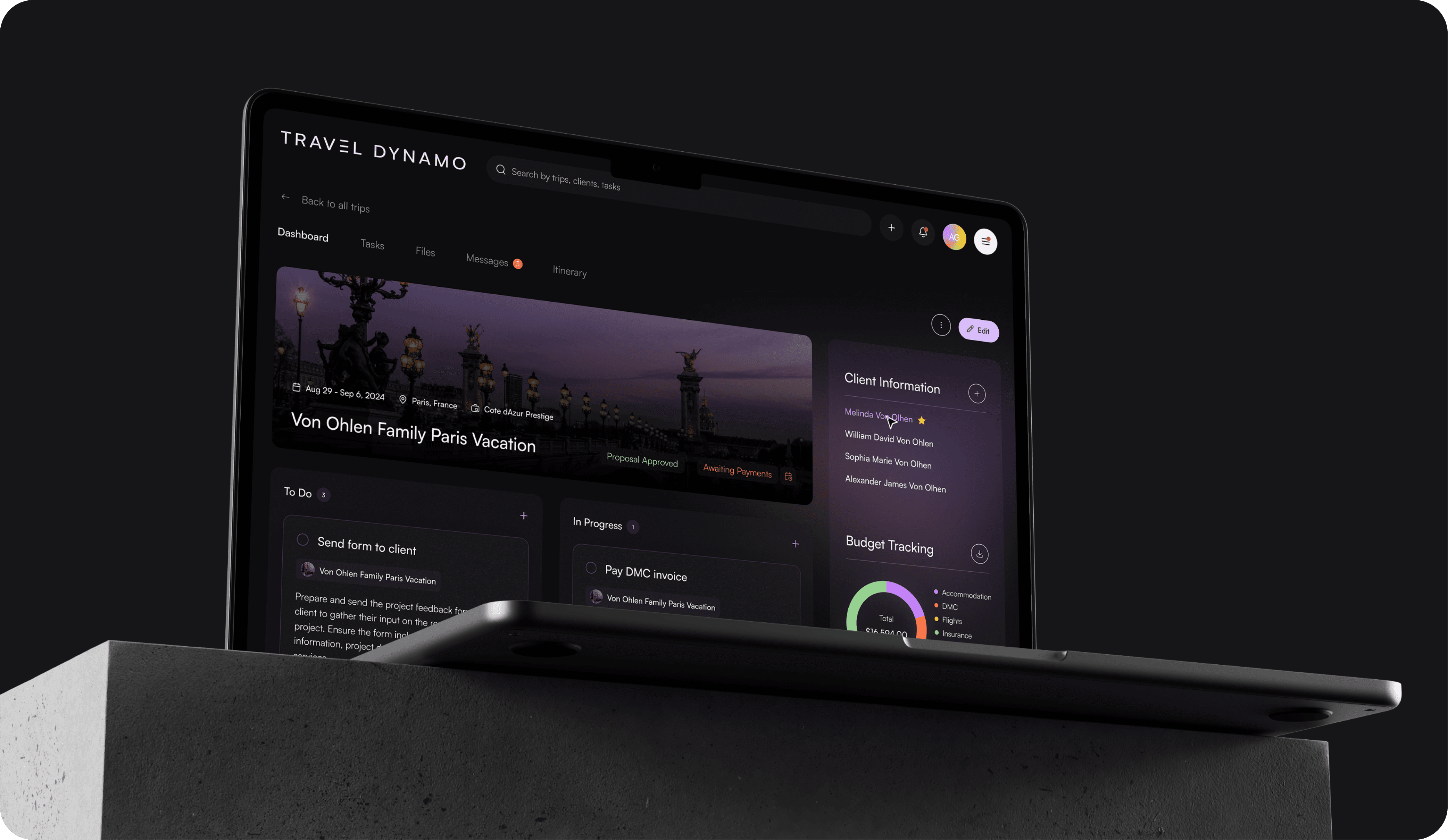 Image of a laptop displaying the 'Travel Dynamo' travel management software on a dark, textured surface. The screen shows a user dashboard for the 'Von Ohlen Family Paris Vacation' with various panels including tasks, files, messages, and itinerary. The dashboard is well-organized, featuring sections like 'Client Information', 'Budget Tracking', and a to-do list with tasks like 'Send form to client' and 'Pay DMC invoice'. The UI is sleek with a dark theme and purple accents, enhancing the visual appeal and readability.