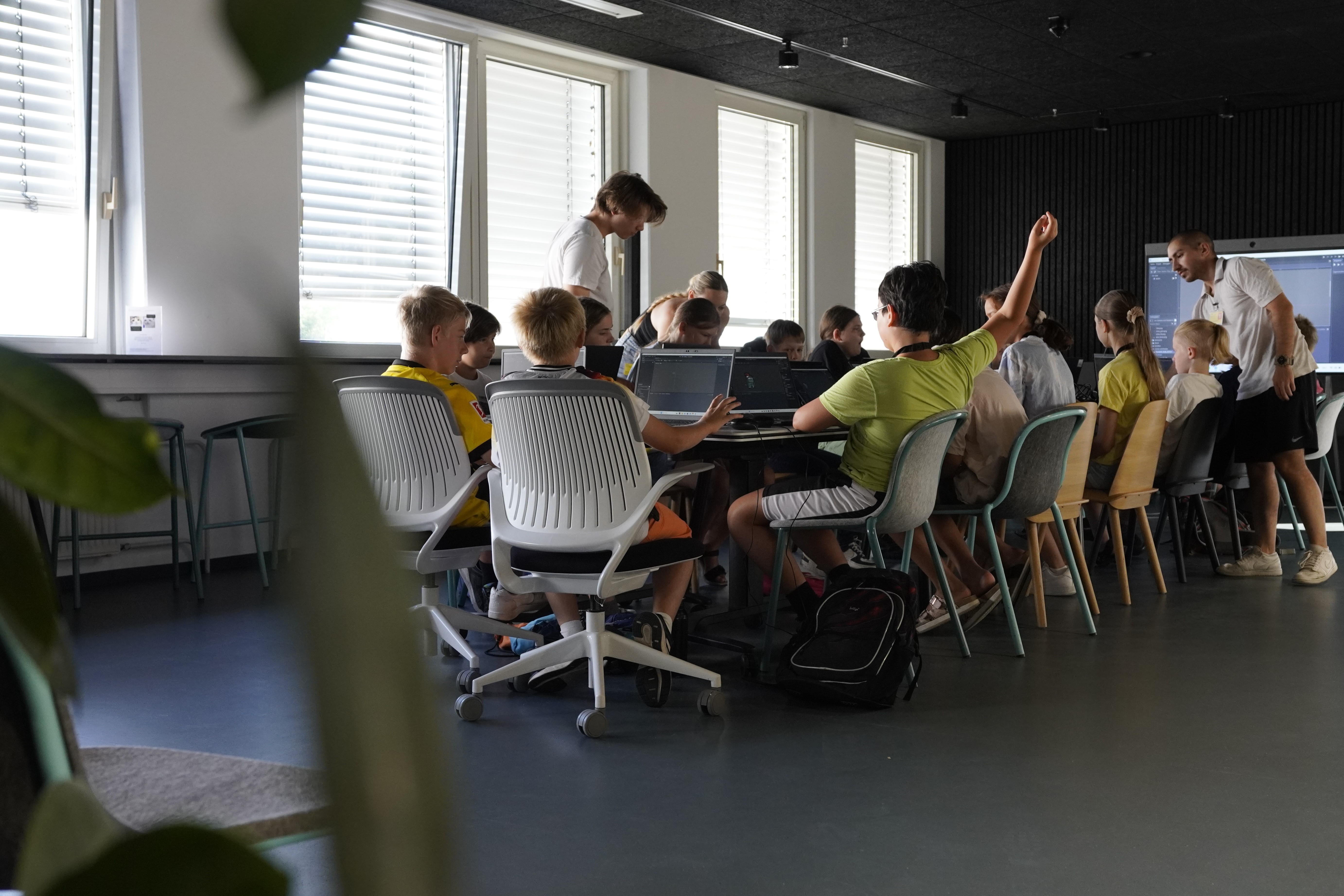 Yoshi and Jasper teaching a game development workshop for kids
