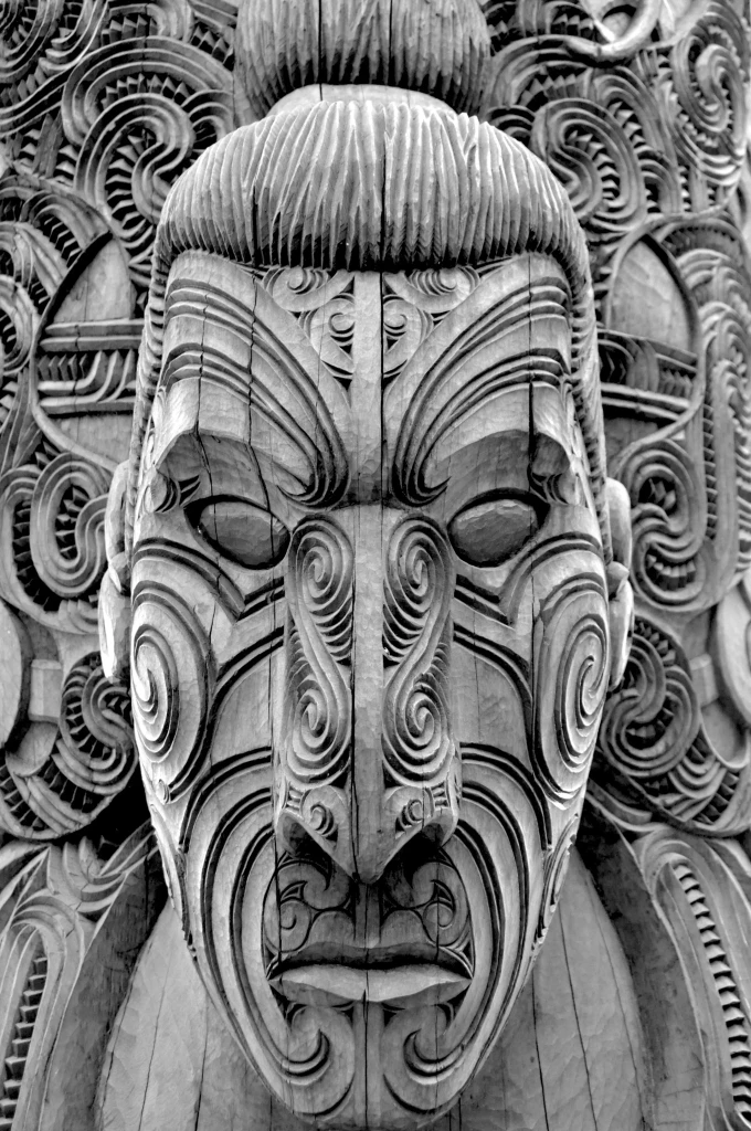 Traditional Māori wood carving at a cultural site in Rotorua, New Zealand visited by private jet charter travellers