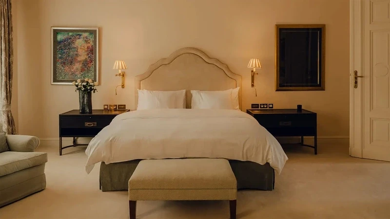 a palace bedroom with a large continental bed
