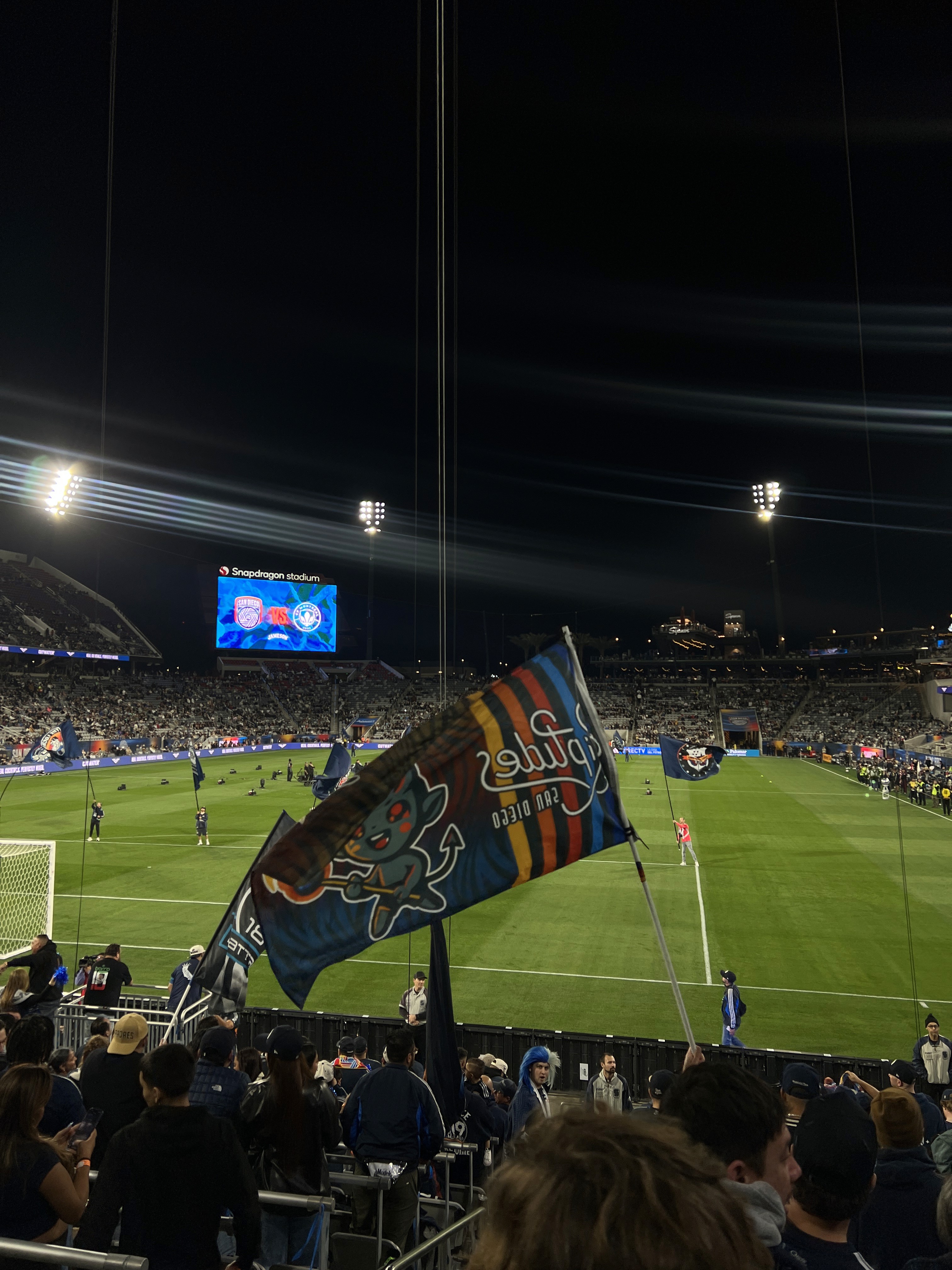 a blurry photo of a person standing in front of a wall