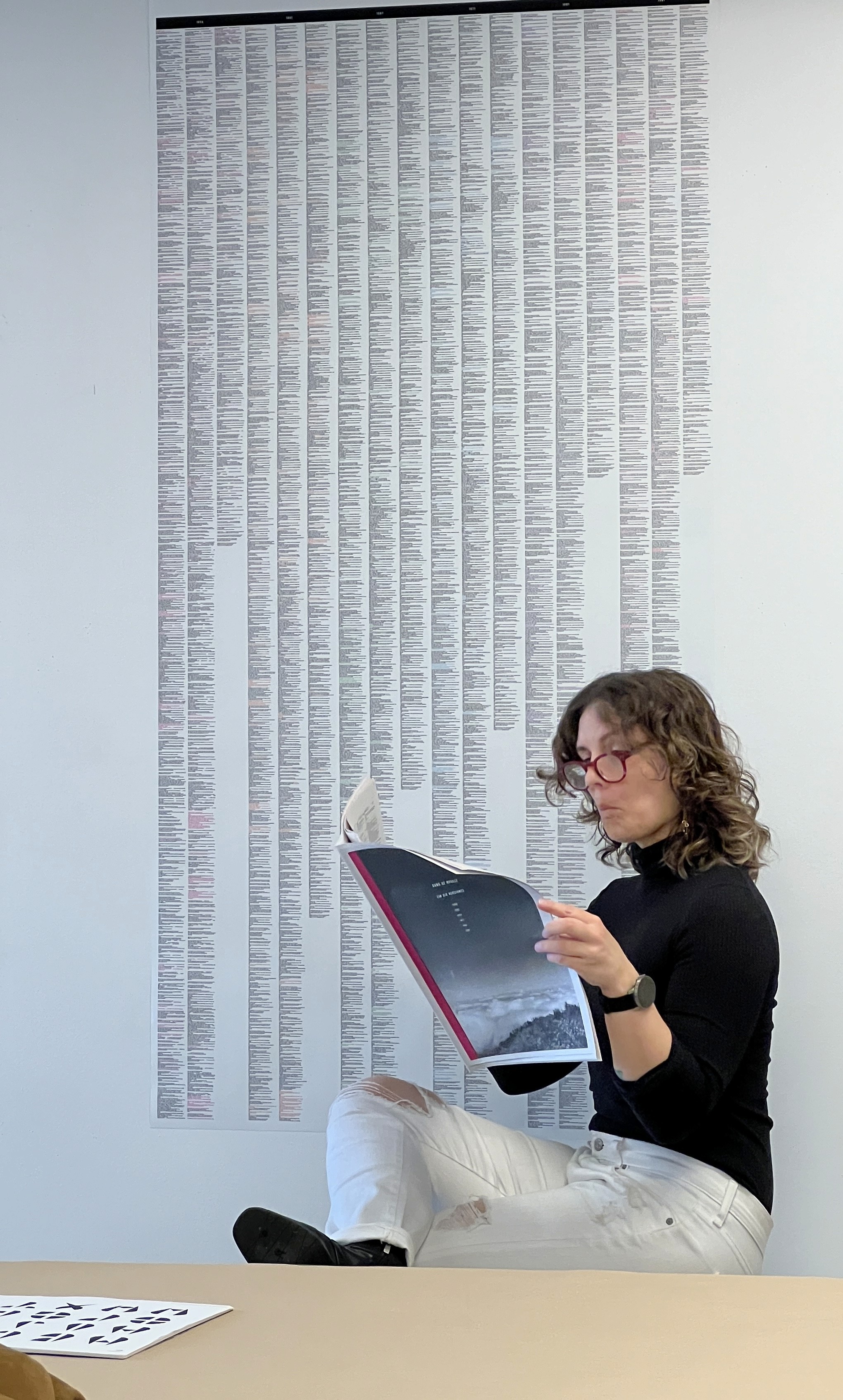 a blurry photo of a person standing in front of a wall