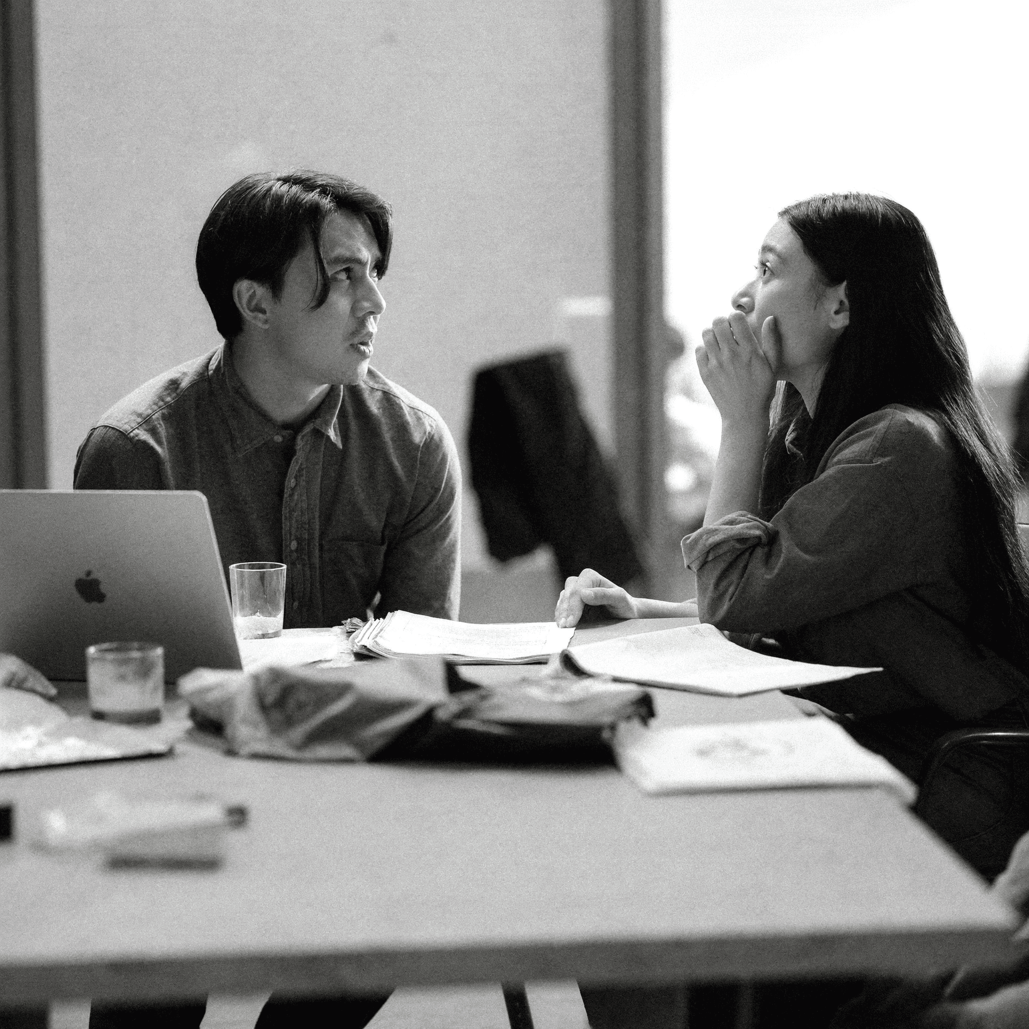 Team members in an office setting having a discussion, representing clear communication throughout the project process.