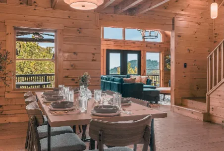 Cabin kitchen with a wood island and bar stools