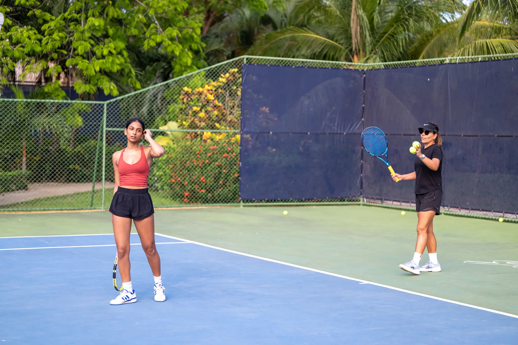 nfinity pool blending into the ocean view, minimalist sun loungers in soft neutral fabric, curved architecture